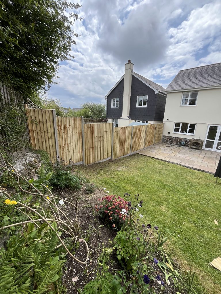 feather edge fencing with concrete posts and gravel boards